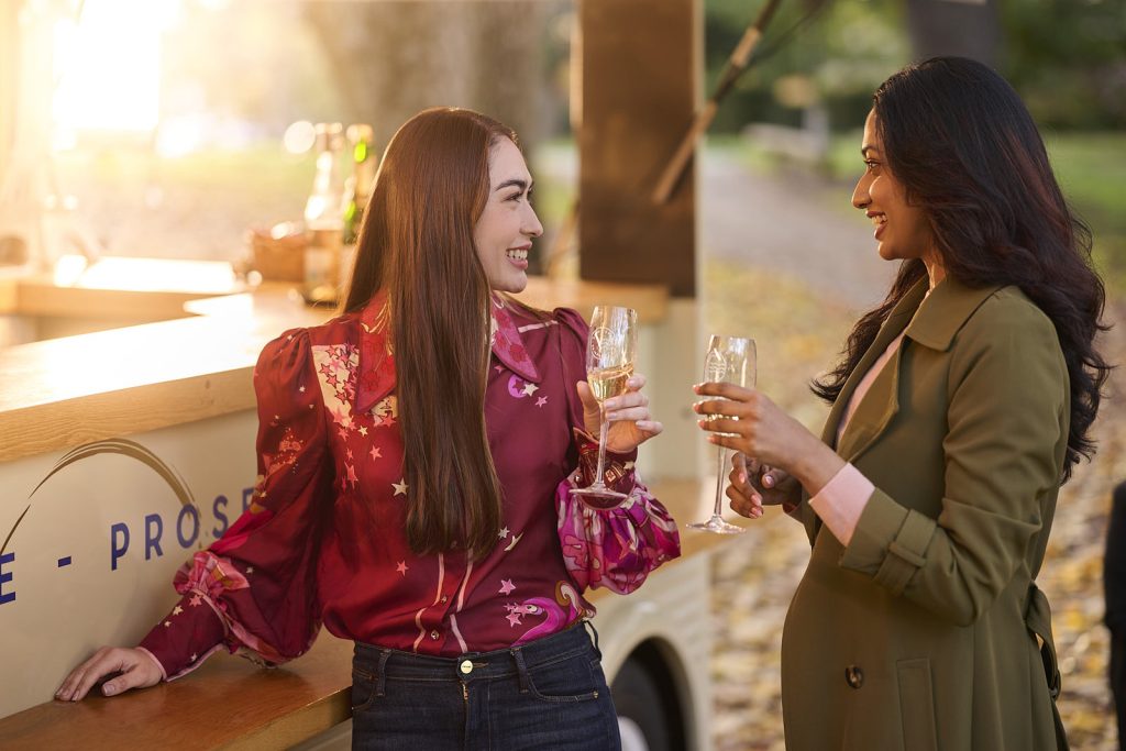 Advertising photo of two women enjoying champagne for Canberra Tourism