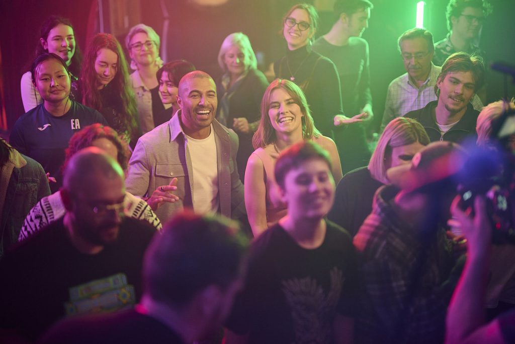 Advertising image of people dancing at a party